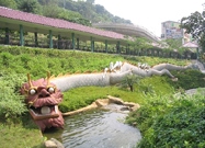 Photo: This dragon lying by the stream livens up the garden in Lung Tak Court. 2011 ©