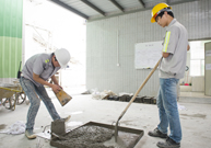 Photo: The Slump Test: first mix the concrete with a shovel and press it into a semi-conical container with an iron rod (left); remove the semi-conical container (middle); and measure the slump (right).