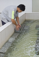 Photo: Concrete cubes being produced (left); production information labels on the concrete cubes (middle); cubes being placed in a curing pool (right).