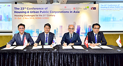 Photo: Mr Stephen Leung of the HA delegation (second right), together with the head of the other three delegations, Mr Wan Khin-wai of the HDB (first left), Mr Jang Chung-mo of the KLHC (second left), and Mr Omori Naoki of the URA (first right), signs the Conference Agreement.