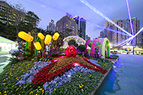 Photo: The illuminated 3D HA logo adorned with a sea of dazzling flowers.