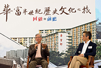 Photo: The first Director of Housing, Dr Donald Liao (left), and the present Director of Housing, Mr Stanley Ying, share stories on public housing developments of their time.