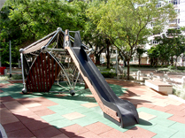 Photo: Exciting play equipment — rope net house with a slide.
