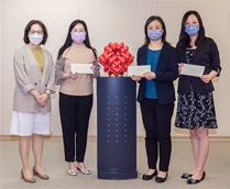 相片：（左起）房屋局常任秘书长王天予与获擢升为总房屋事务经理的黎陈慧芬、总屋宇保养测量师的王锦华和总产业测量师的冯怡合照。