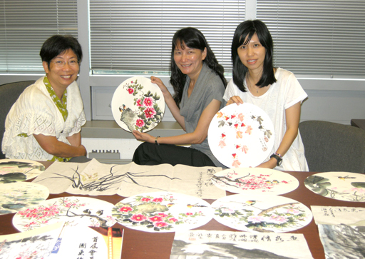 Photo: Some members of the group - (from left) Millie, Vivian and Ellie share their pleasures in learning Chinese painting.