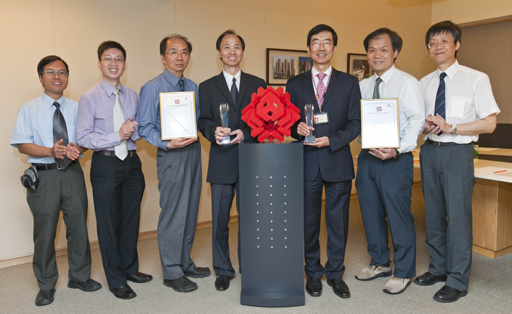 Photo: Chief Manager/Management (Support Services) Dr H W Pang (third from right) and his teammates from the Structural Condition Monitoring Unit of the Housing Department are proud of the honours earned by the repair projects.