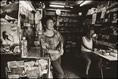 Photo: The owners of the grocery enjoy a home-made meal in the store.