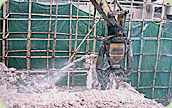 Photo: Hydraulic concrete crusher used in the Lam Tin pilot project.