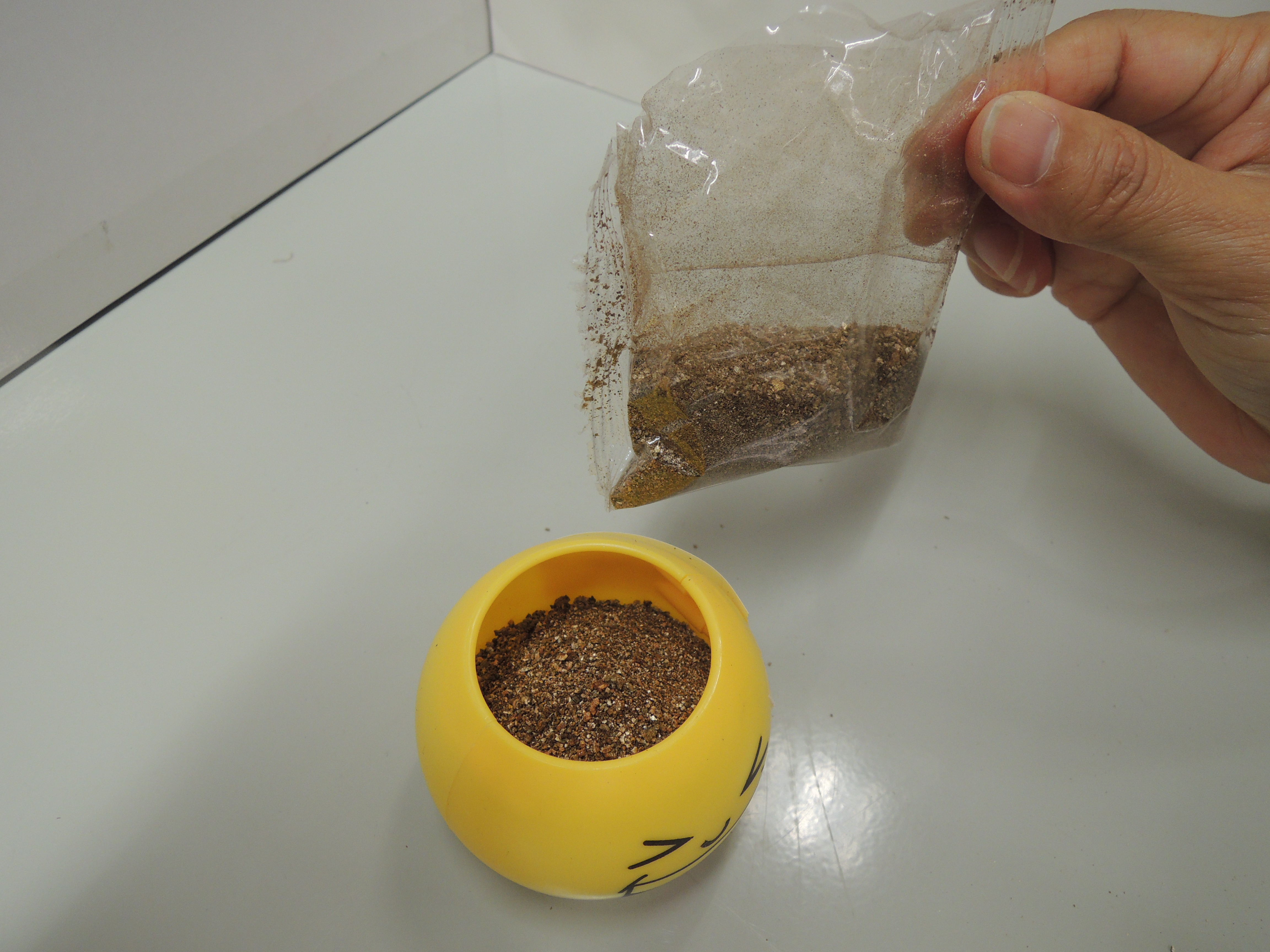 3. Cover the seeds with the remaining one-fifth of the soil 1