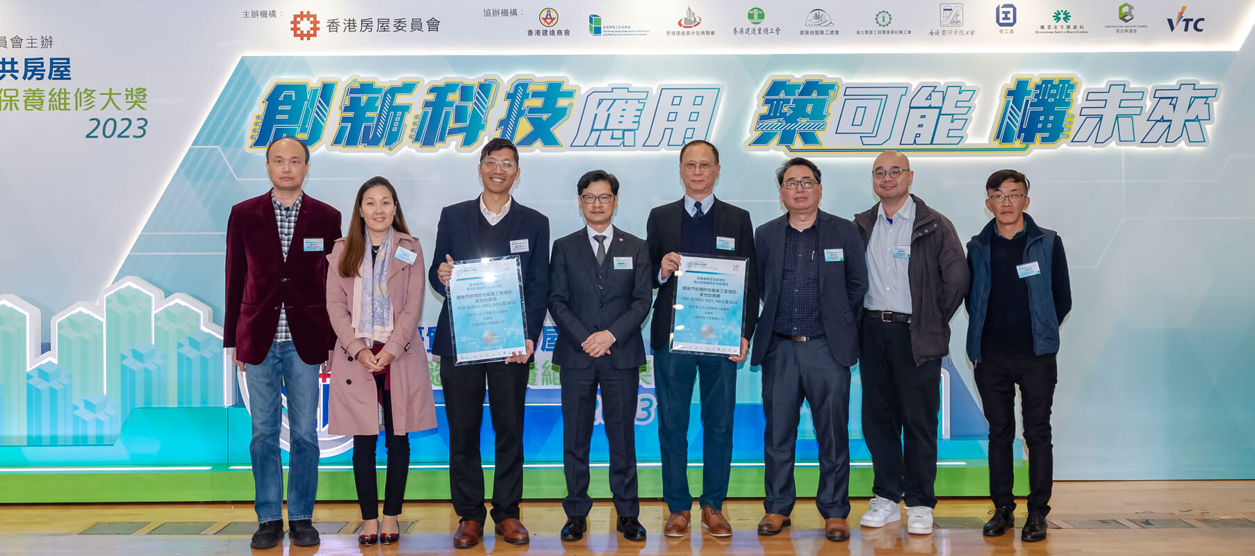 "Outstanding Maintenance & Improvement Projects (Silver)" — pictured with the Deputy Director of Housing (Estate Management), Mr Ricky Yeung (fourth left) are representatives of the Project Team of the Silver Award winning project — Preventive Maintenance Works of Steel Flexible Barrier for Feature Nos. 11SE-B/ND1, ND2, ND3 and ND4 at Lei Yue Mun Estate.